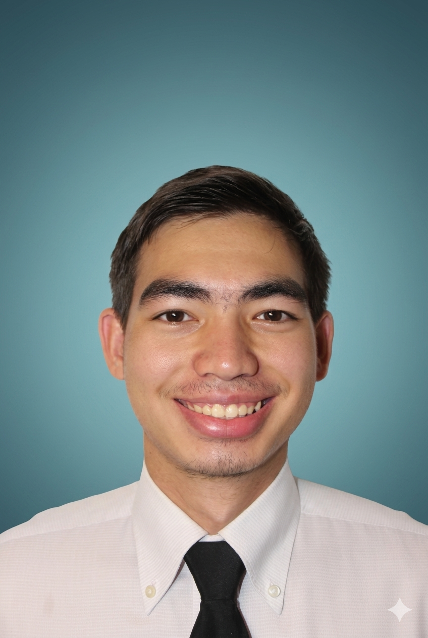 A picture of Sikko dokphor with a black tie on and a blue background.